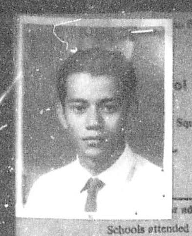 Black and white portrait of a young man wearing a shirt and tie.