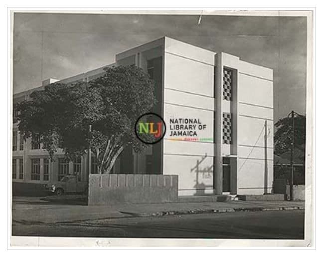 The National Library of Jamaica building, a modernist concrete structure with a distinctive patterned facade.