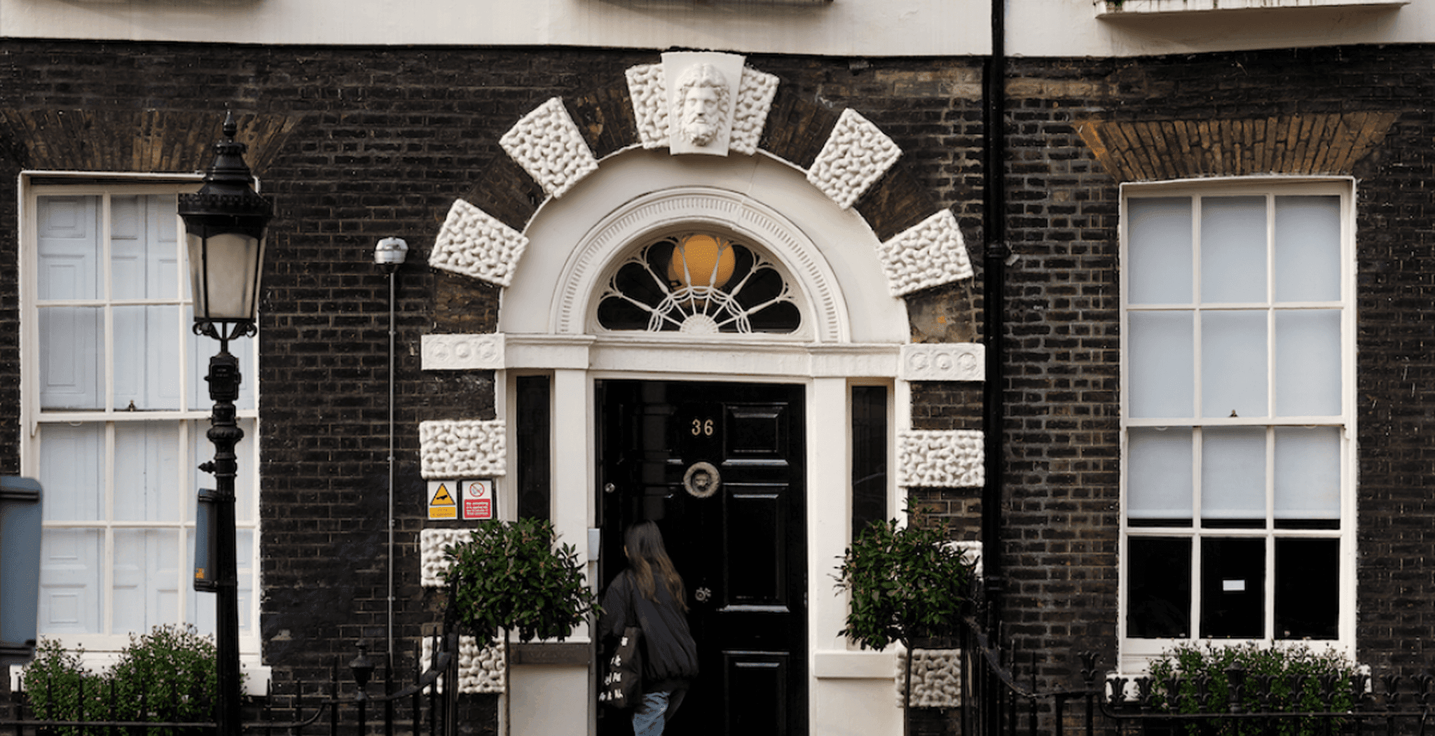 Student entering the front door of the AA