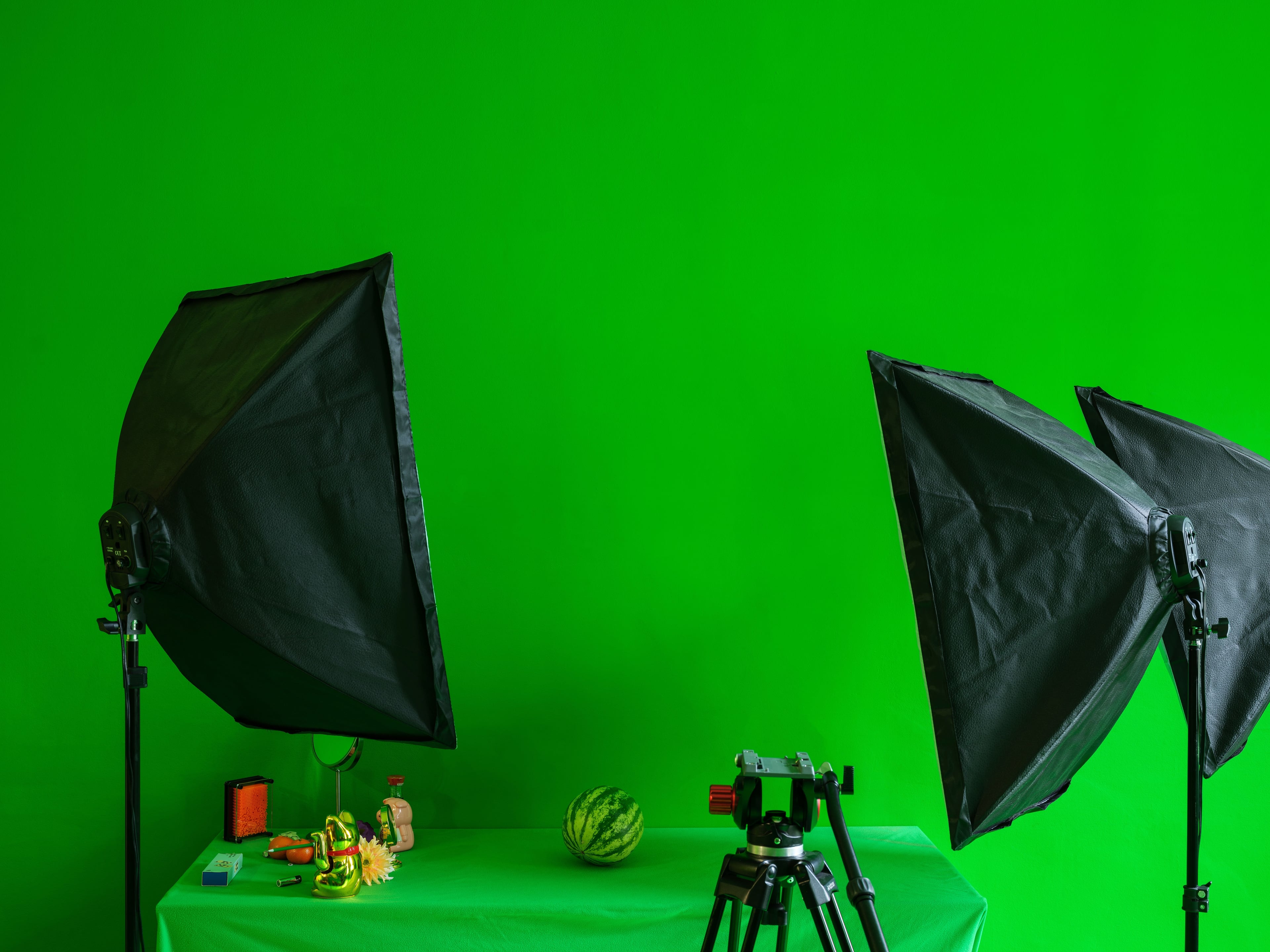 Studio lights against a green screen background